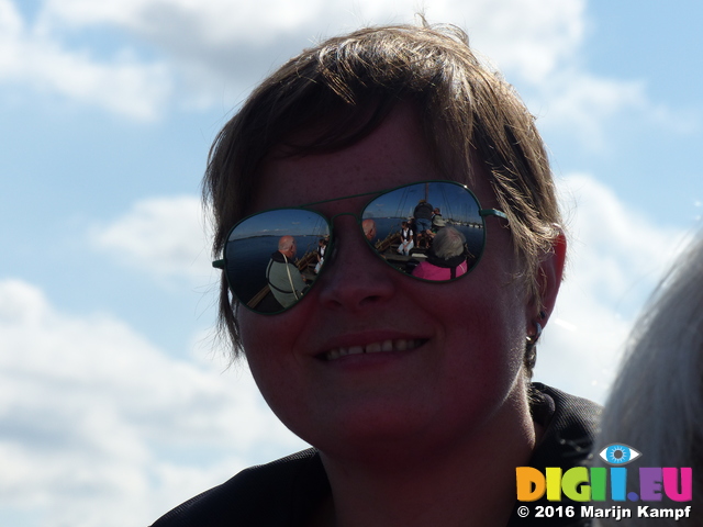 FZ033057 Viking boat reflected in Jenni's sunglasses